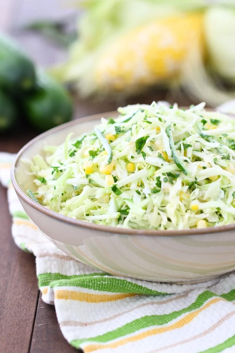 Cabbage cucumber salad - crunchy and fresh, with corn, apples and fresh herbs. 