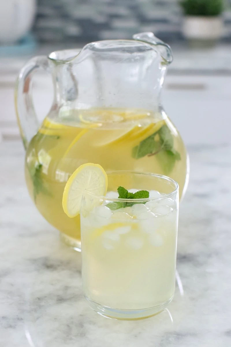 Homemade Mint Lemonade in a pitcher
A glass of homemade lemonade