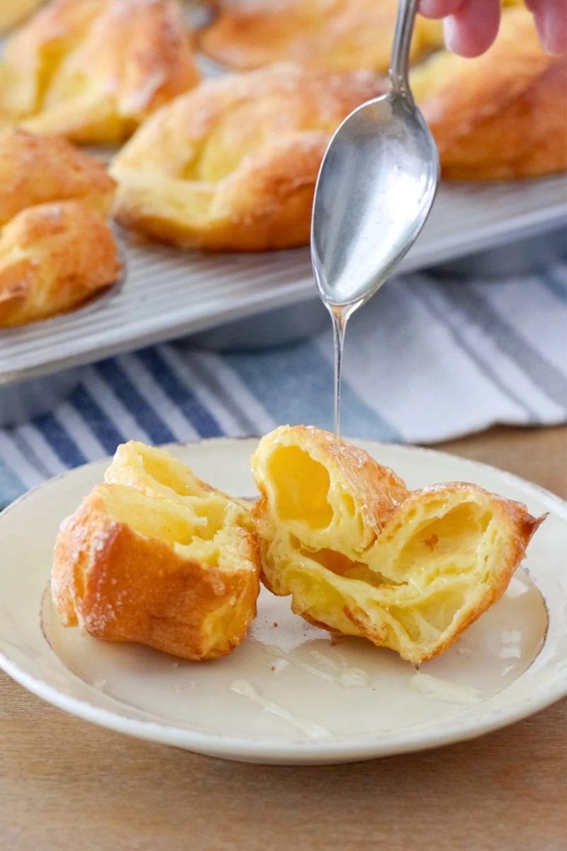 Nun's Puffs, pate choux pastry baked in a muffin pan, served with honey