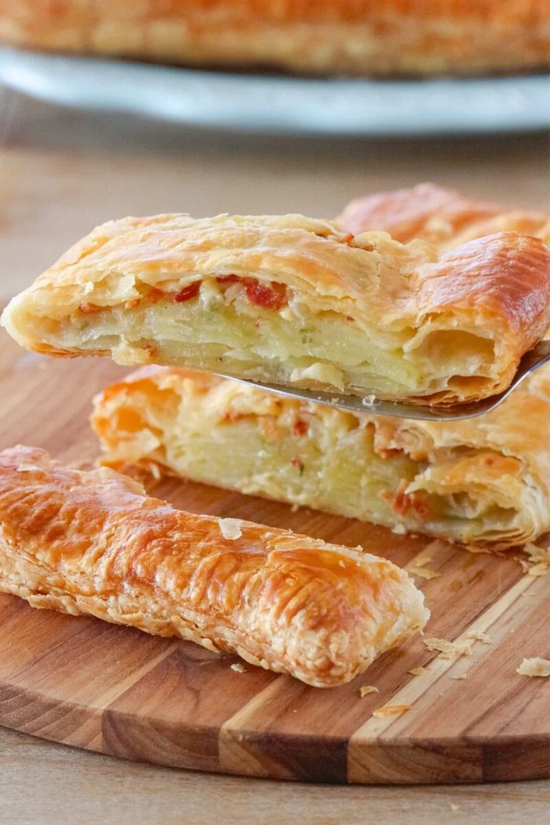 Potato Pastry made with sliced potatoes, onions, bacon and cheese encased in puff pastry. 