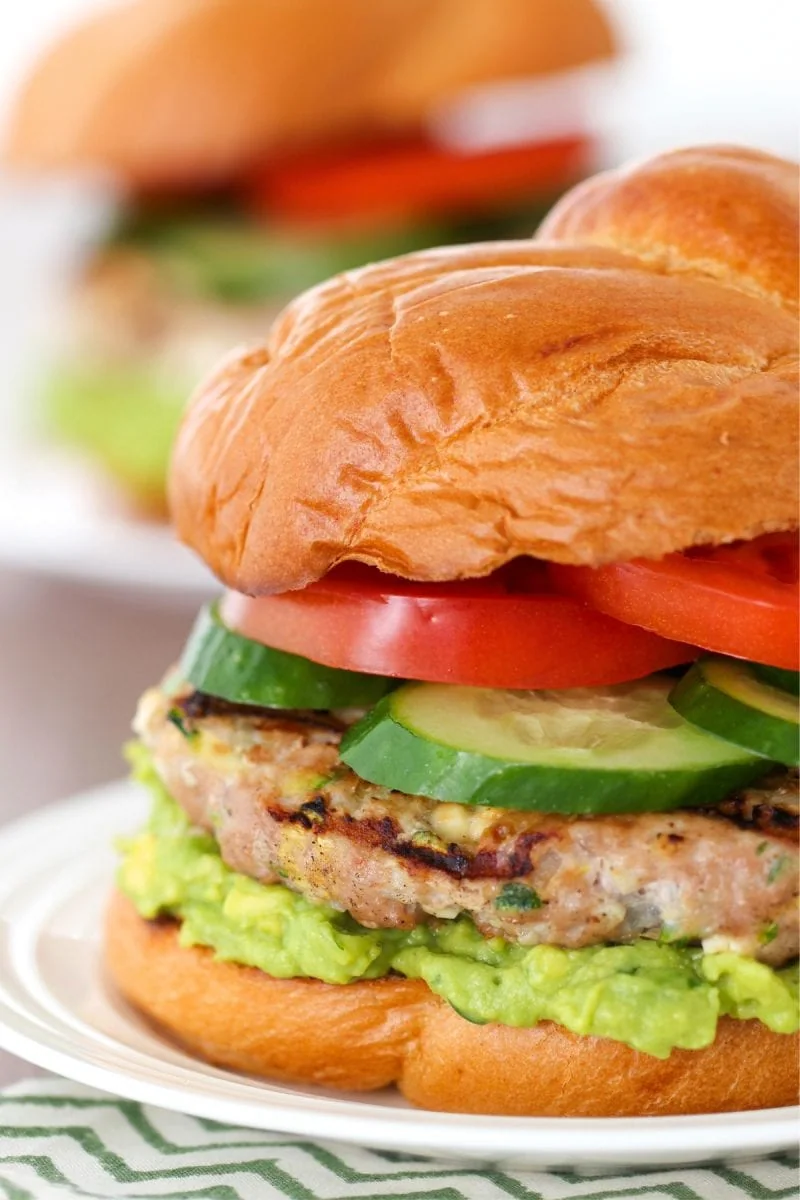 Turkey Zucchini Burgers with feta cheese, guacamole, tomatoes and cucumbers