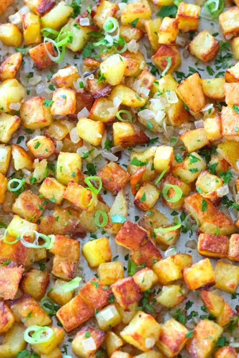 Crispy Breakfast Potatoes in the Oven potatoes and onions with fresh herbs