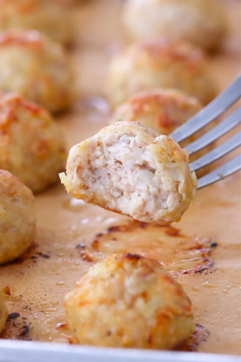 Center bite of a baked chicken meatball
