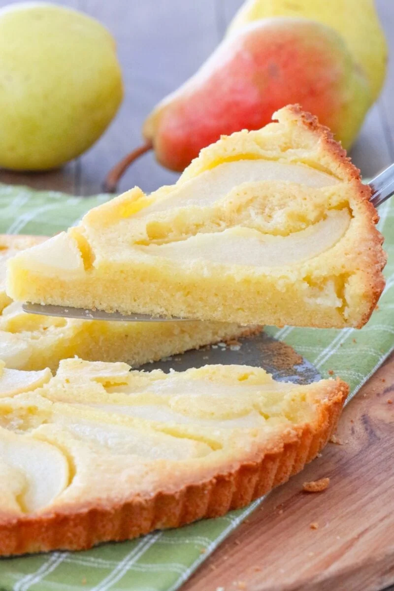 Pear Almond Tart, a slice in a tart pan