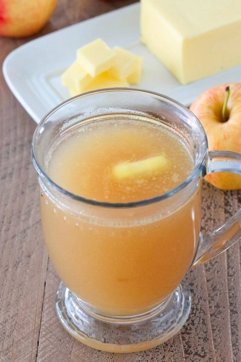 Slow Cooker Apple Cider made with fresh apples, served with salted butter. 