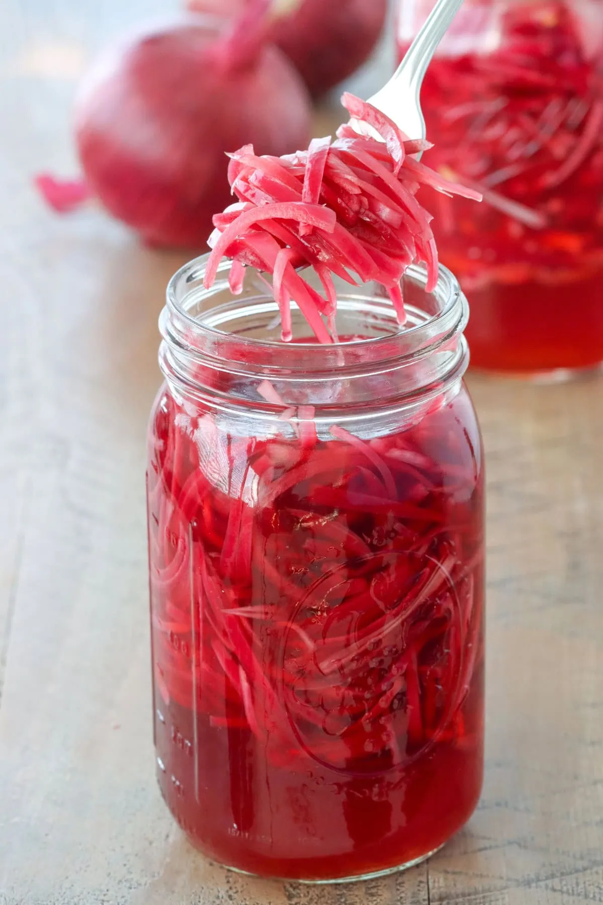 Easy pickled red onions in a glass mason jar. 